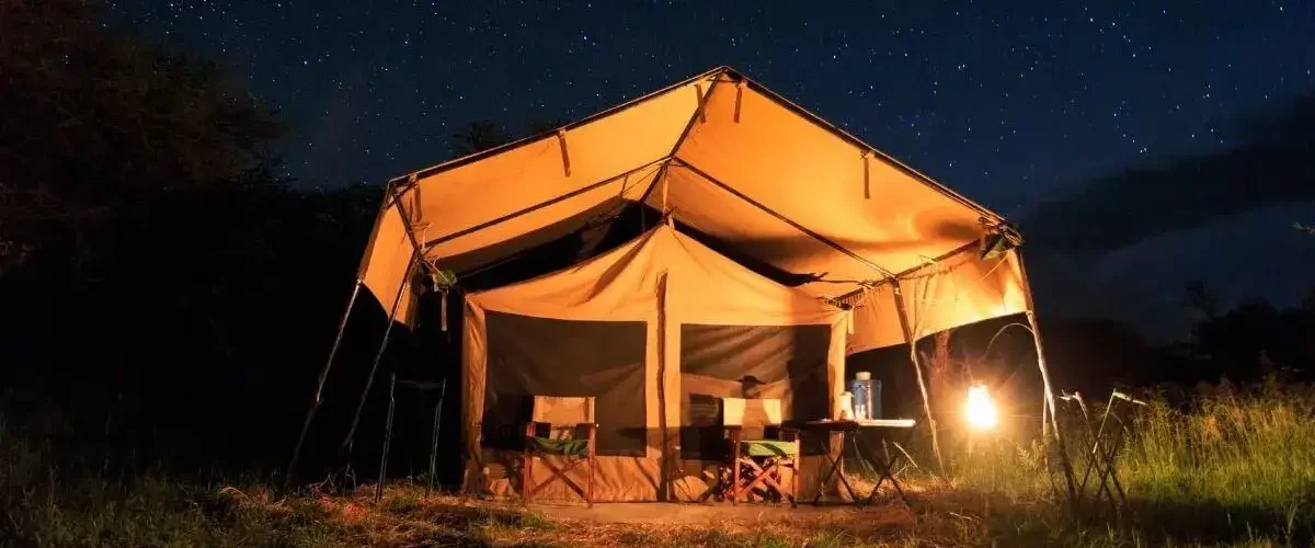 Adventurers enjoying an affordable camping safari in Tanzania, organized by JM Tours.