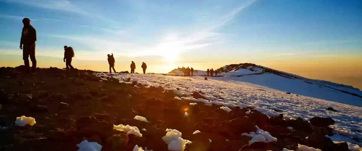 An epic sunrise casting a golden glow over a panoramic view.