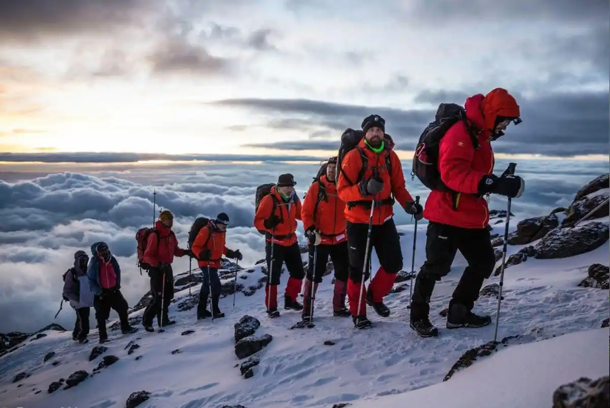 A group of hikers embarking on Kilimanjaro climbing expeditions with JM Tours.